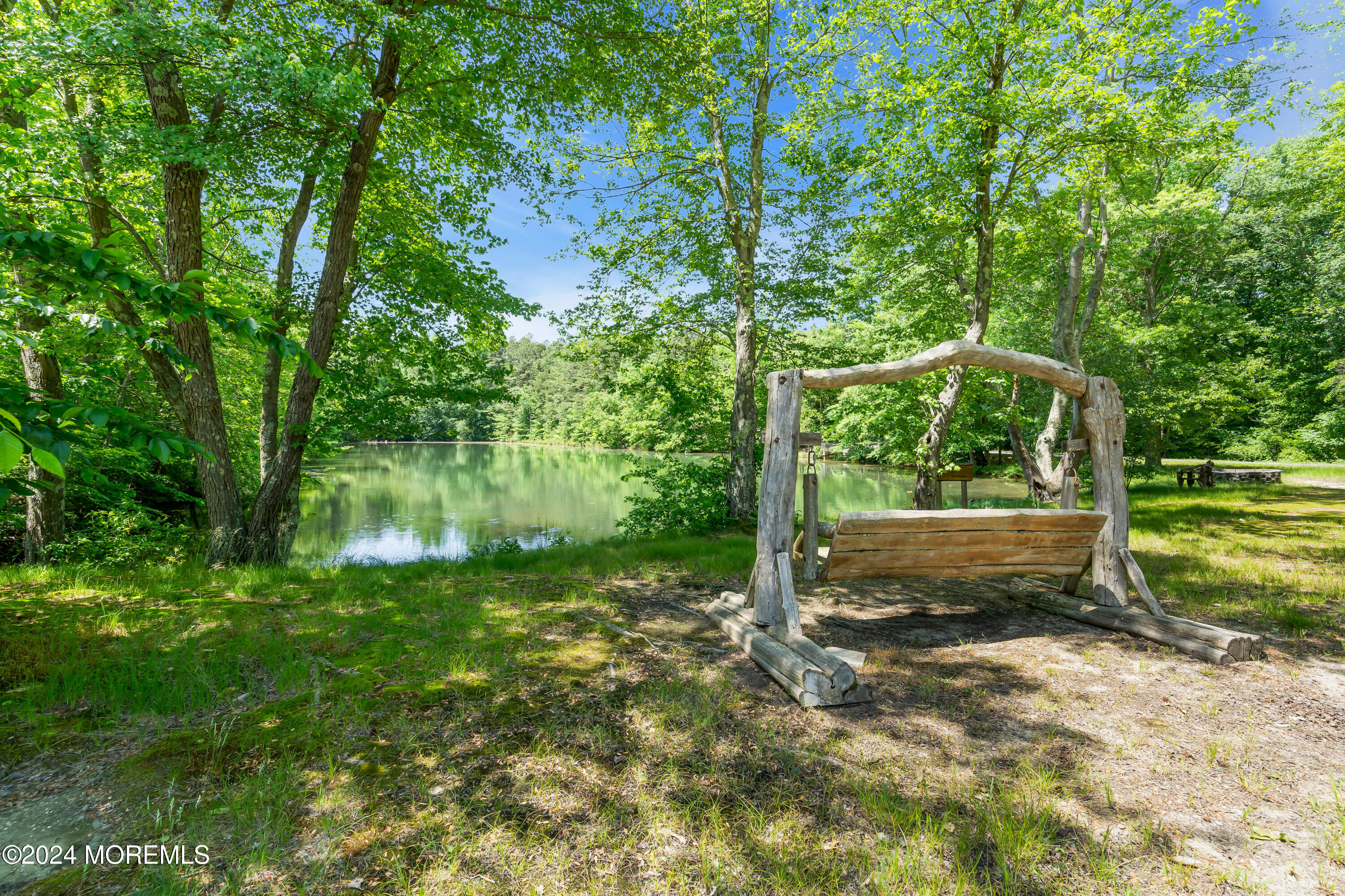 724 Monmouth Road, Unit 40 Cream Ridge, NJ 08514 - Photo 28 of 33 a view of a yard with a tree