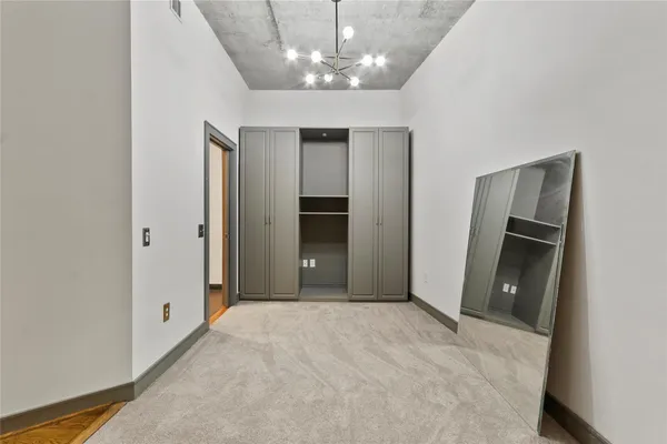 a view of a hallway with a chandelier