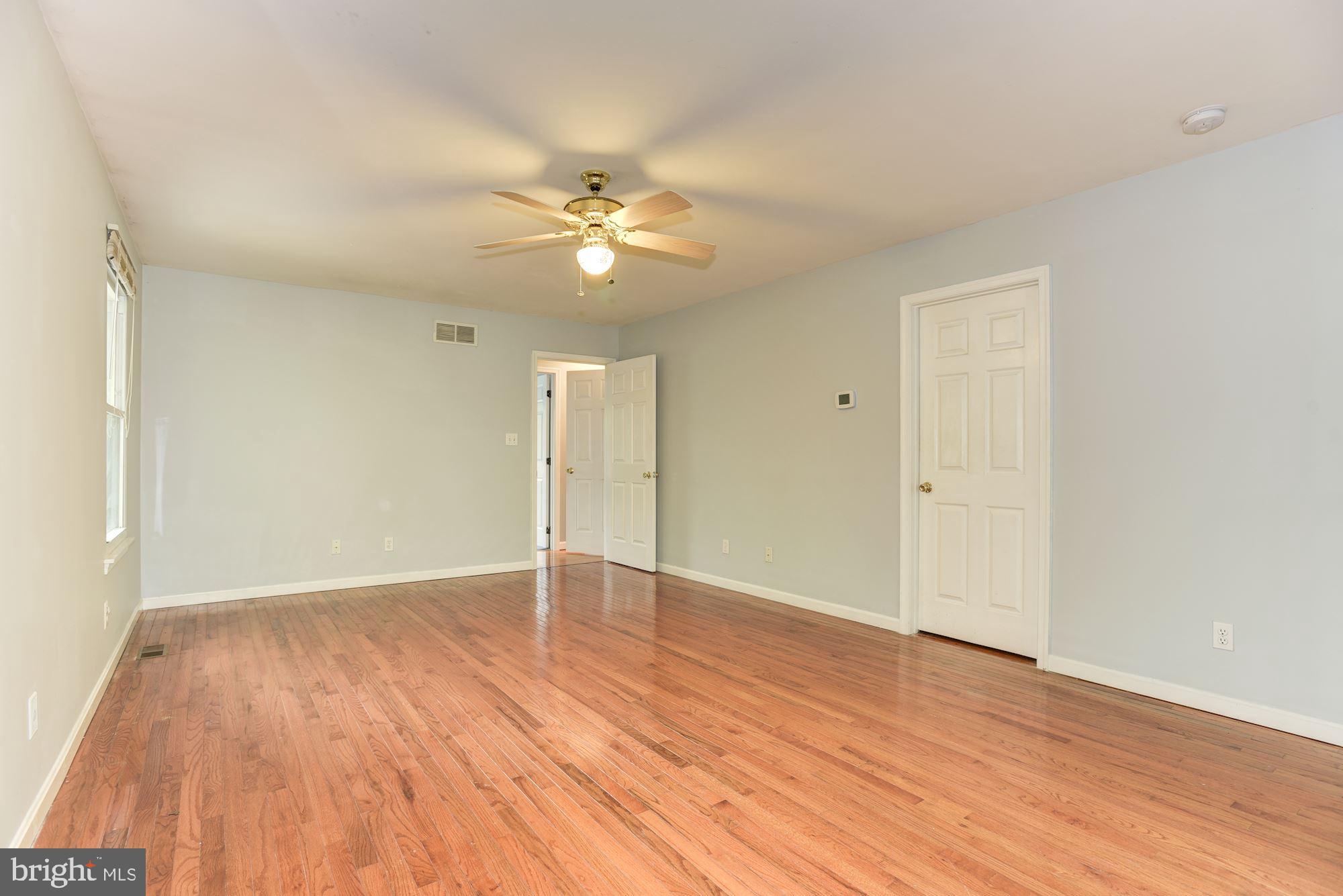 7349 Gaither Road Sykesville, MD 21784 - Photo 14 of 37 Primary Bedroom | Hardwood Floors | Walk-In Closet