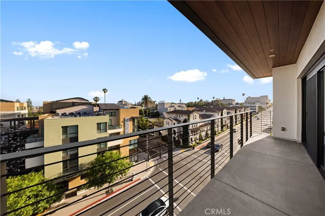 a view of a balcony with chairs