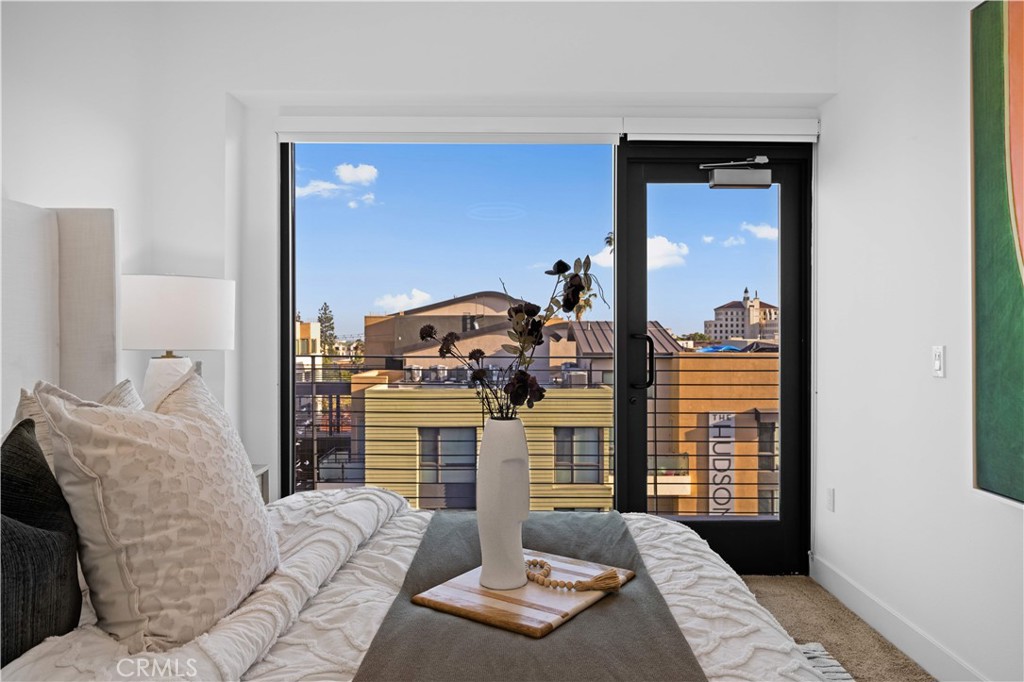 218 North El Molino Avenue, Unit 502 Pasadena, CA 91101 - Photo 12 of 35 a living room with furniture and a fireplace