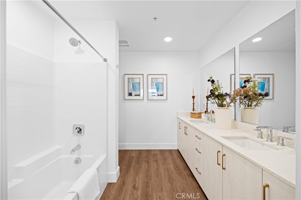 218 North El Molino Avenue, Unit 502 Pasadena, CA 91101 - Photo 17 of 35 a spacious bathroom with a double vanity sink a mirror and a bathtub