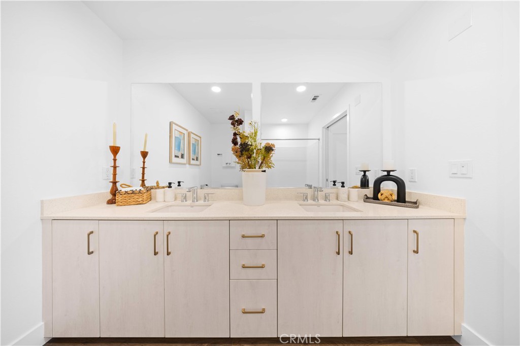 218 North El Molino Avenue, Unit 502 Pasadena, CA 91101 - Photo 18 of 35 a bathroom with a sink and a mirror