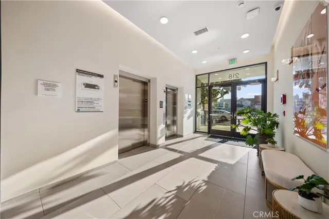 a spacious bathroom with a granite countertop tub shower and mirror