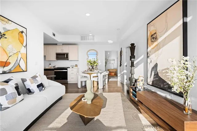 a living room with furniture fireplace and a flat screen tv