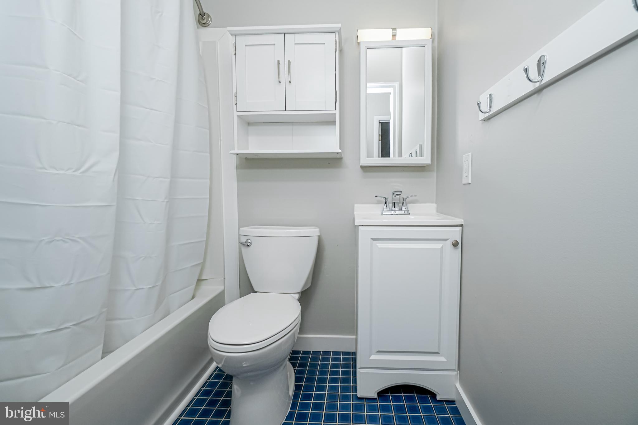 18 Hatteras Court Elkton, MD 21921 - Photo 15 of 21 a bathroom with a sink toilet and a mirror