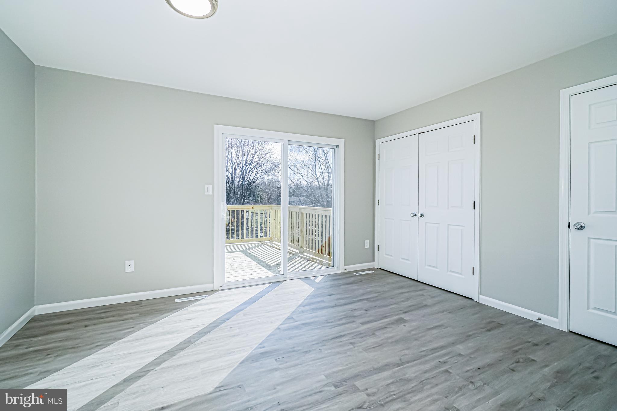 18 Hatteras Court Elkton, MD 21921 - Photo 7 of 21 a view of an empty room with wooden floor and a window
