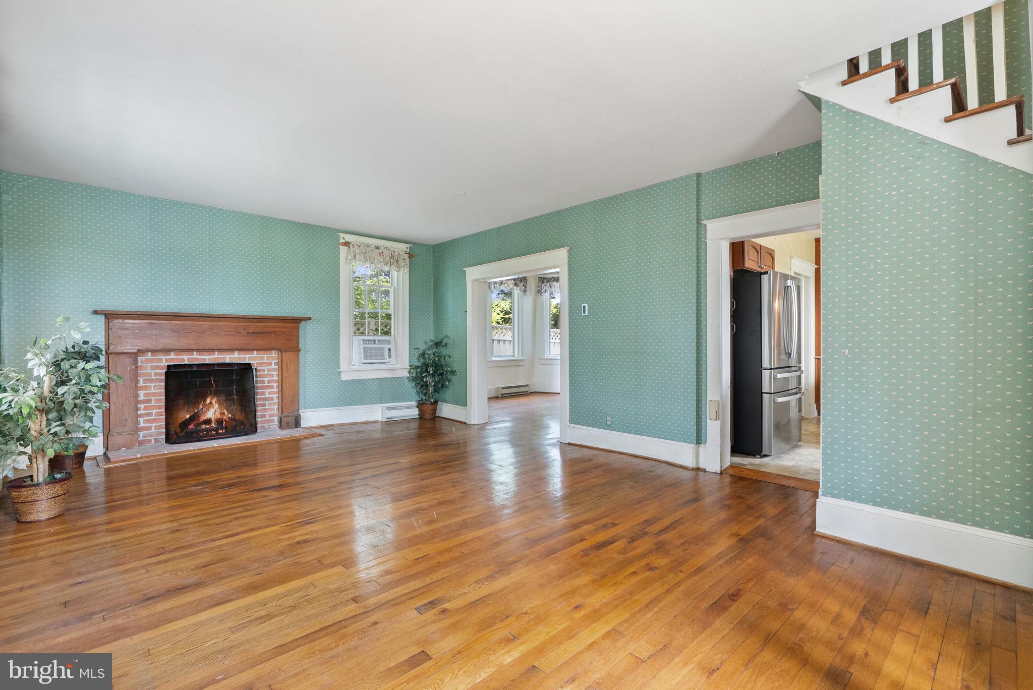 64 Salem Church Road Boyce, VA 22620 - Photo 11 of 59 a view of a livingroom with wooden floor and a fireplace