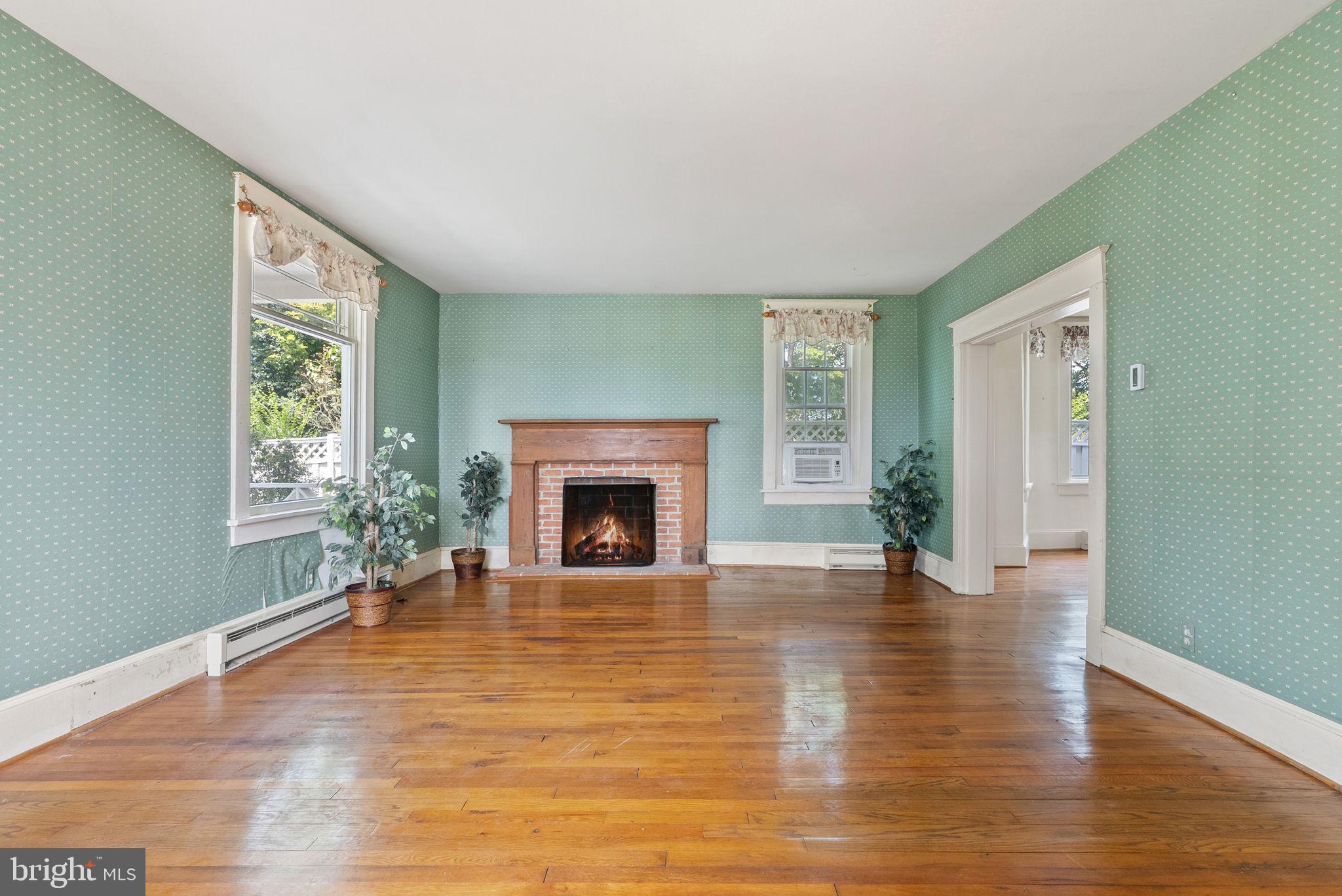 64 Salem Church Road Boyce, VA 22620 - Photo 12 of 59 a view of empty room with fireplace and wooden floor