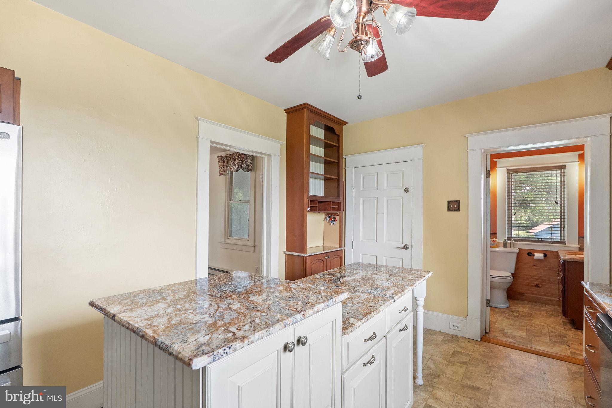 64 Salem Church Road Boyce, VA 22620 - Photo 20 of 59 a bathroom with a granite countertop sink and a mirror