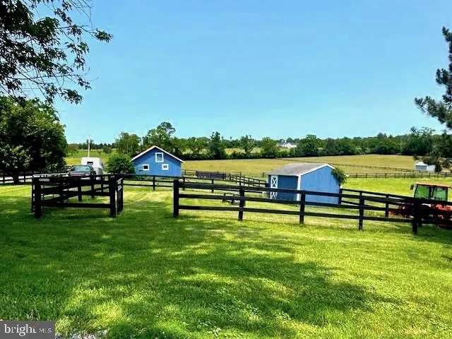 a view of a yard with an outdoor space