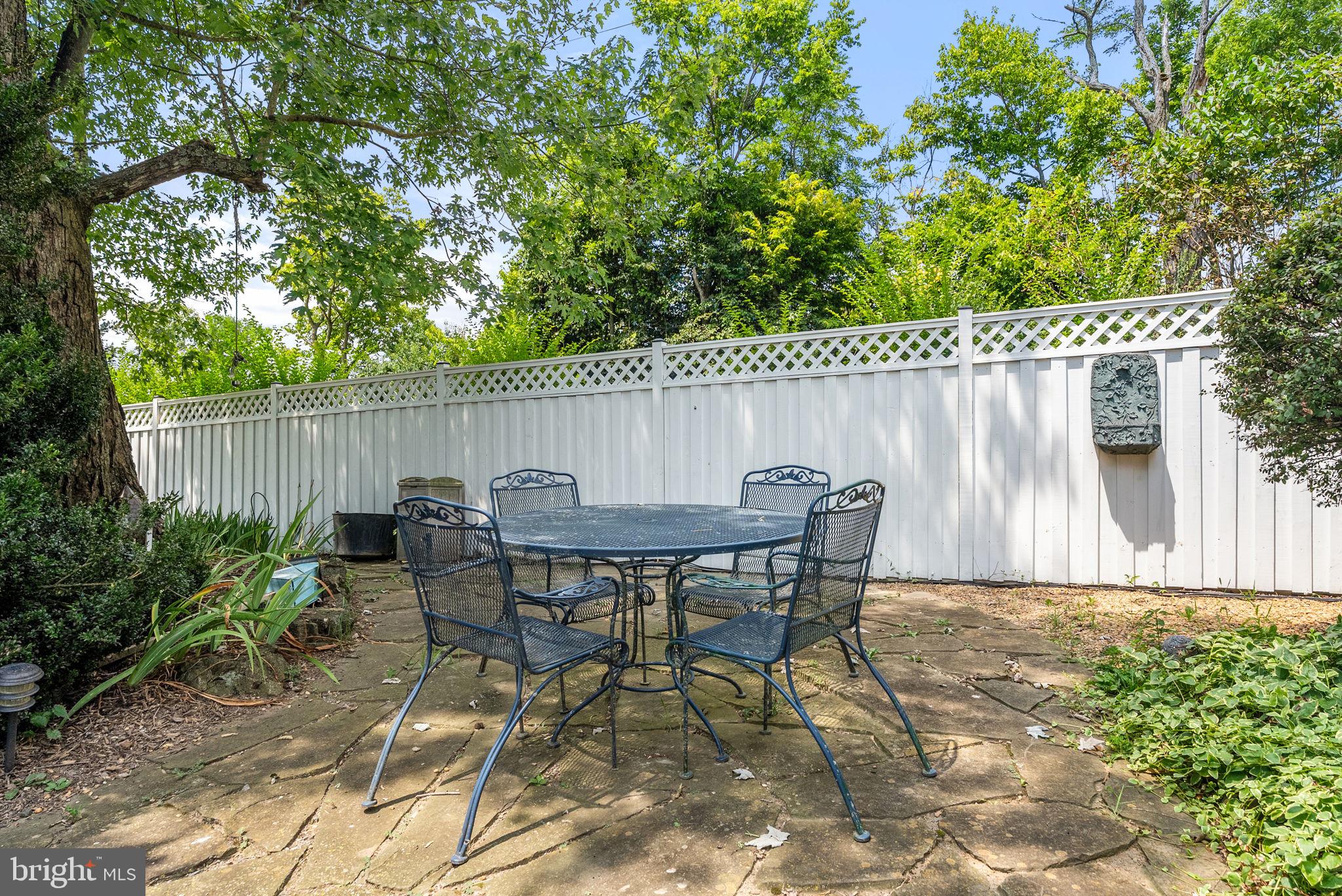 64 Salem Church Road Boyce, VA 22620 - Photo 10 of 59 a view of a patio with table and chairs with wooden fence and plants