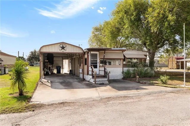 a view of a house with basketball court