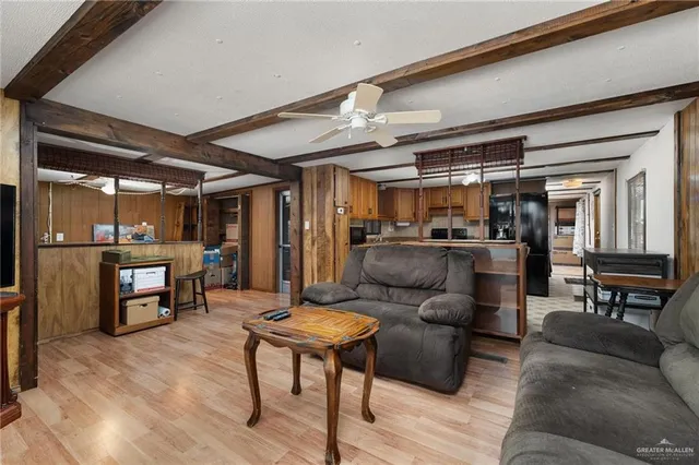 a living room with furniture and a glass door