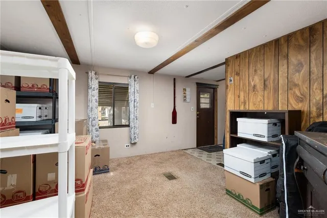 a room with furniture and flat screen tv