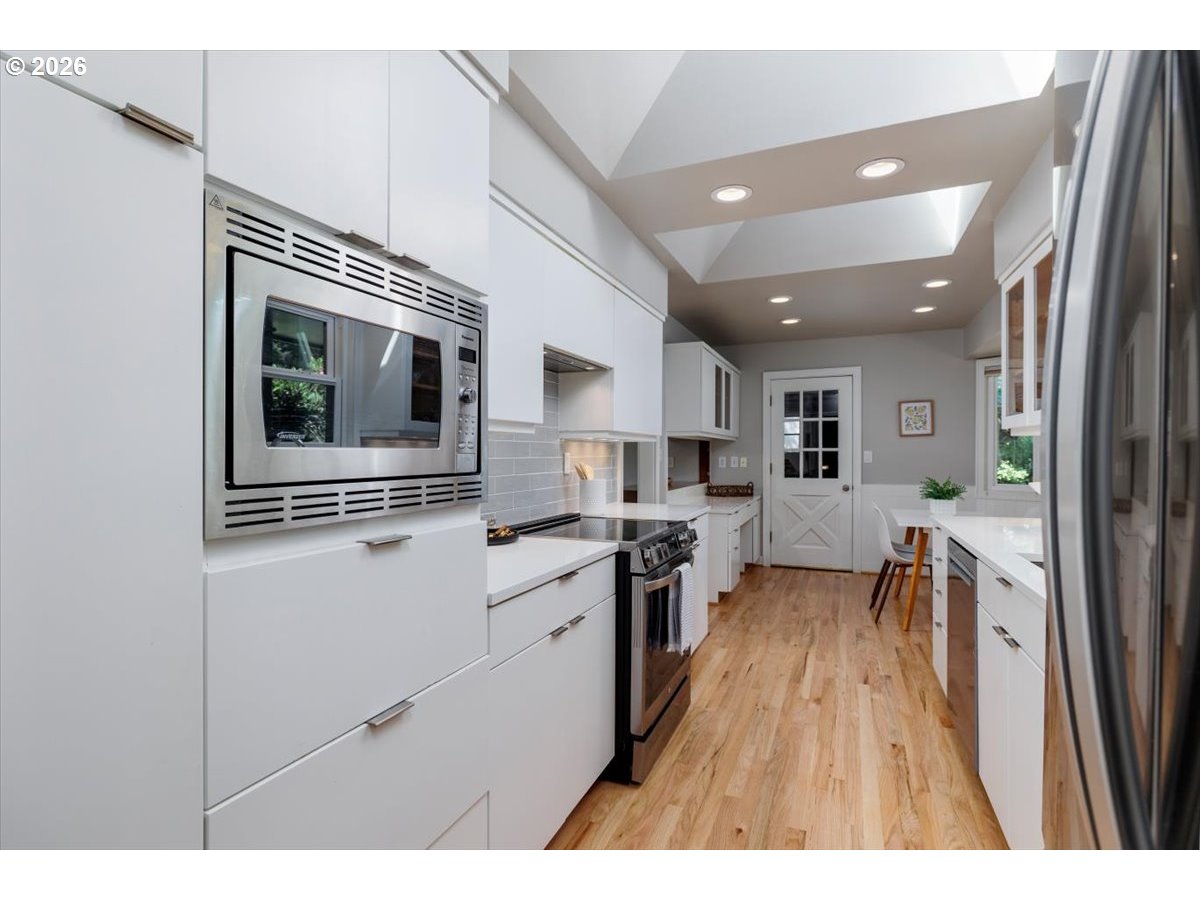 175 Northwest 95th Avenue Portland, OR 97229 - Photo 14 of 46 a open kitchen with sink and stainless steel appliances