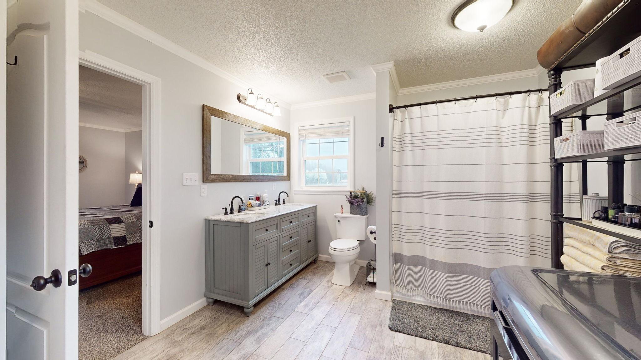 221 Limestone Road Elora, TN 37328 - Photo 29 of 47 a bathroom with a double vanity sink toilet mirror and bathtub