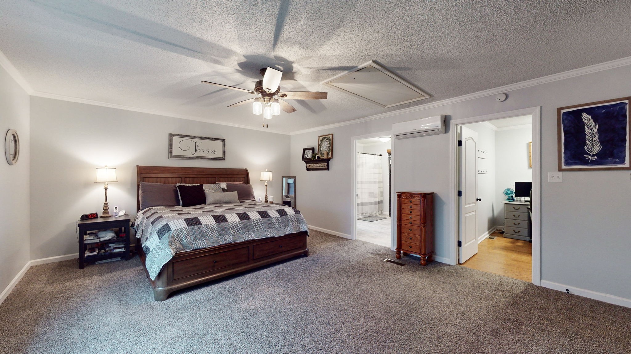 221 Limestone Road Elora, TN 37328 - Photo 32 of 47 a spacious bedroom with a bed and a chandelier