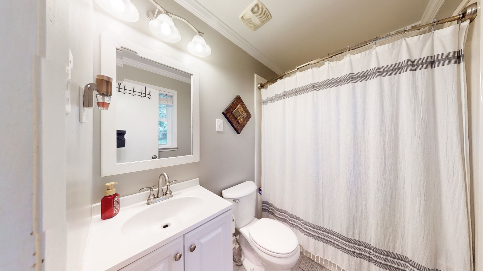 221 Limestone Road Elora, TN 37328 - Photo 38 of 47 a bathroom with a sink a toilet and shower curtain