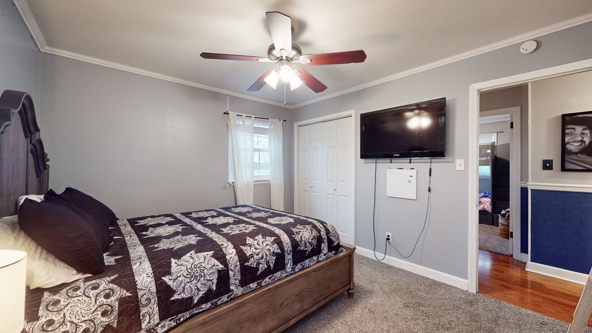 221 Limestone Road Elora, TN 37328 - Photo 39 of 47 a bedroom with a bed and a flat tv screen on wall