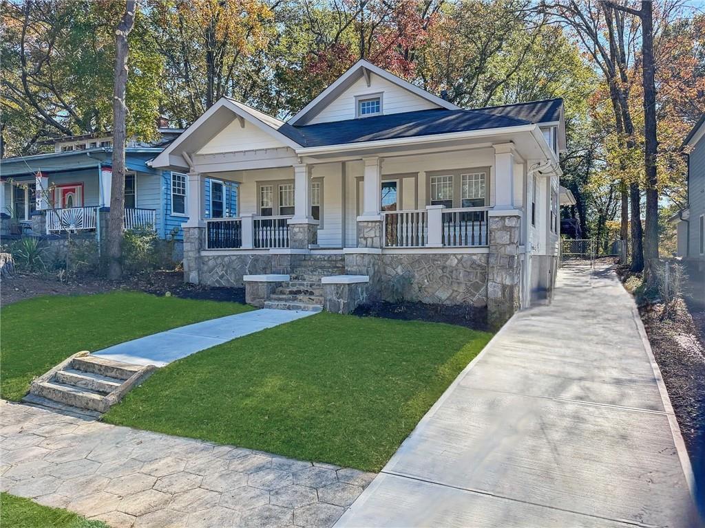1514 Mozley Place Southwest Atlanta, GA 30314 - Photo 1 of 1 a front view of a house with a yard