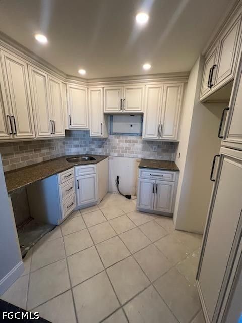 2350 West First Street, Unit 603 Fort Myers, FL 33901 - Photo 11 of 17 a kitchen with stainless steel appliances granite countertop a sink and white cabinets