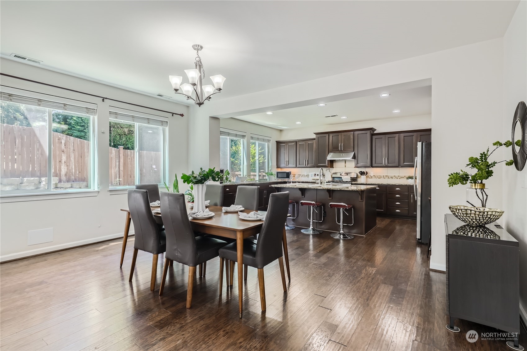 3606 196th Place Southeast Bothell, WA 98012 - Photo 13 of 39 a view of a dining room with furniture window and wooden floor