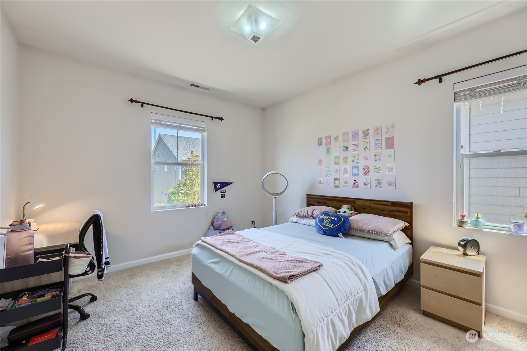 3606 196th Place Southeast Bothell, WA 98012 - Photo 25 of 39 a bedroom with a bed and a chandelier