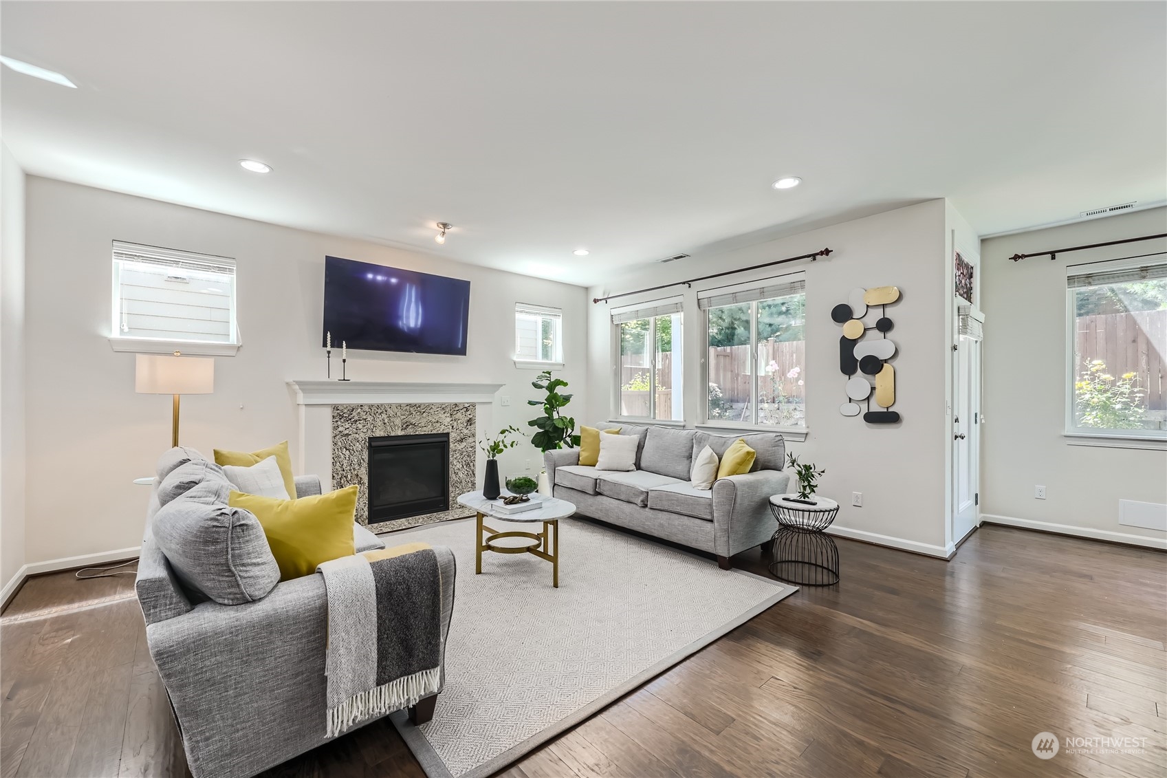3606 196th Place Southeast Bothell, WA 98012 - Photo 5 of 39 a living room with furniture flat screen tv and a fireplace