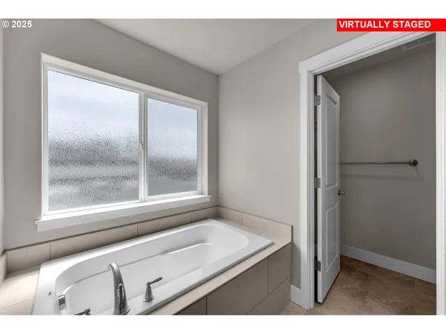 a bathroom with a shower and a mirror