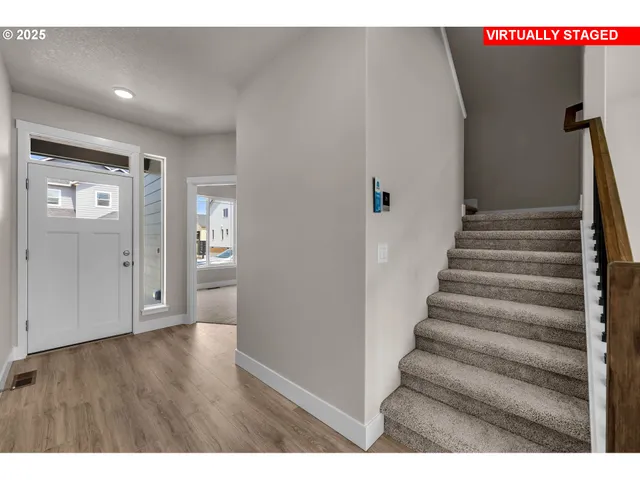 a view of kitchen with furniture and wooden floor