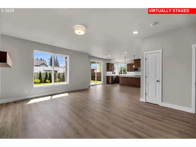 a view of a kitchen with a sink and a stove top oven