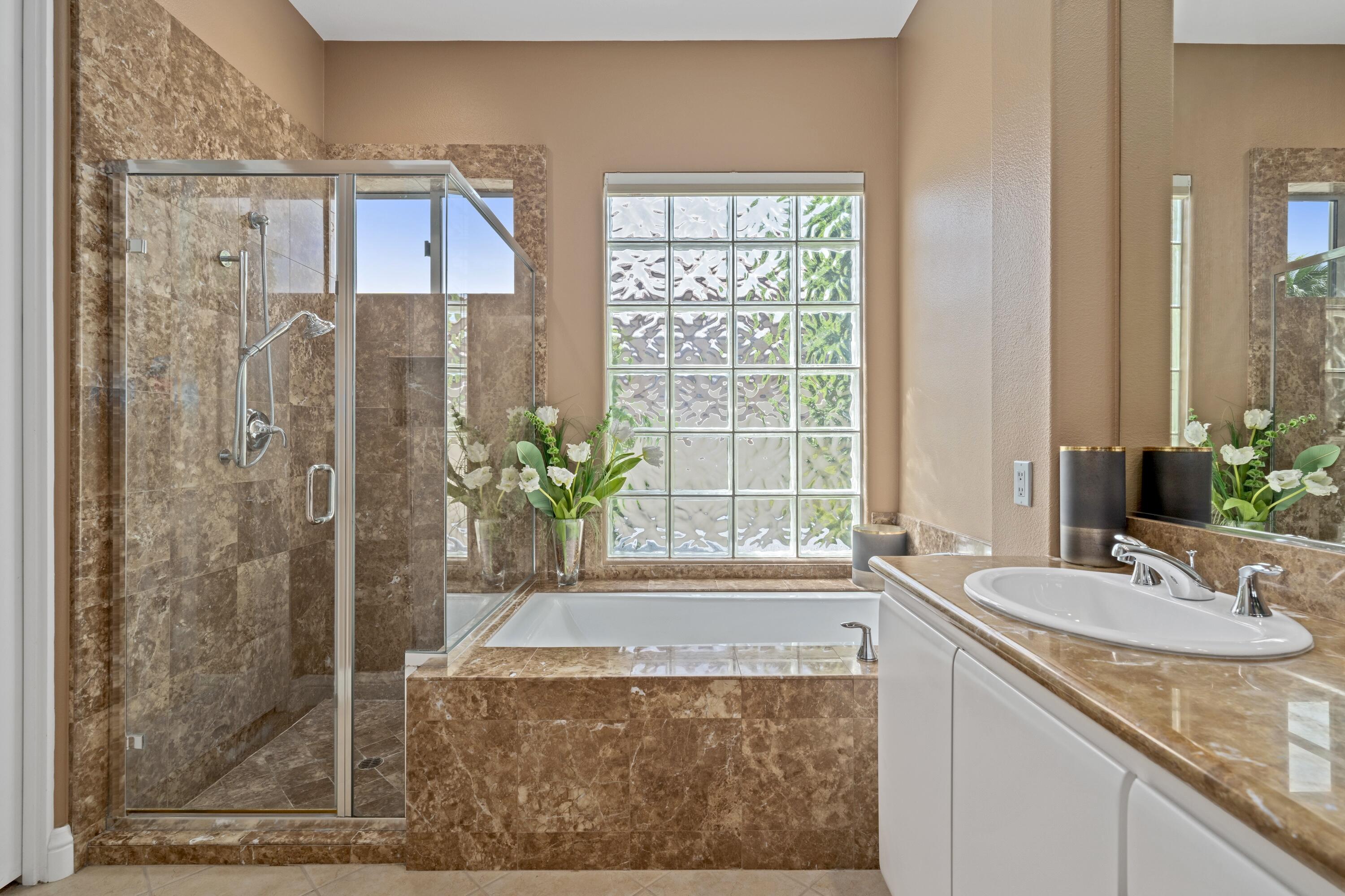 269 Loch Lomond Road Rancho Mirage, CA 92270 - Photo 33 of 53 a bathroom with a granite countertop sink and a mirror