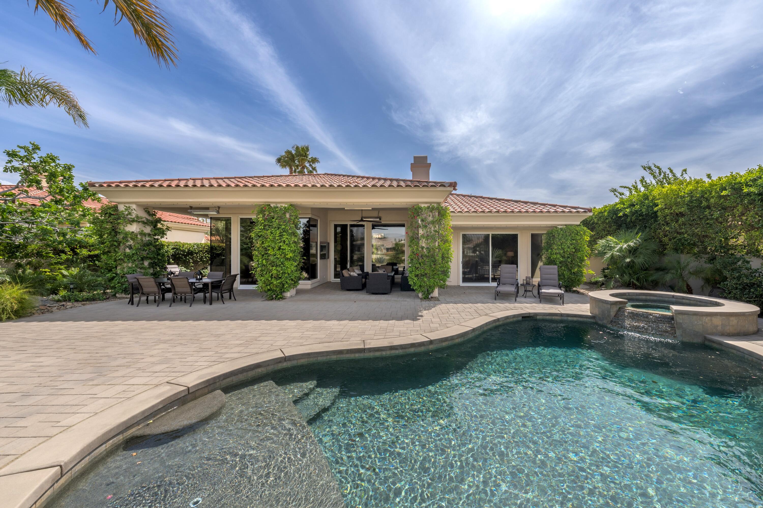 269 Loch Lomond Road Rancho Mirage, CA 92270 - Photo 43 of 53 a view of a house with sitting area and garden