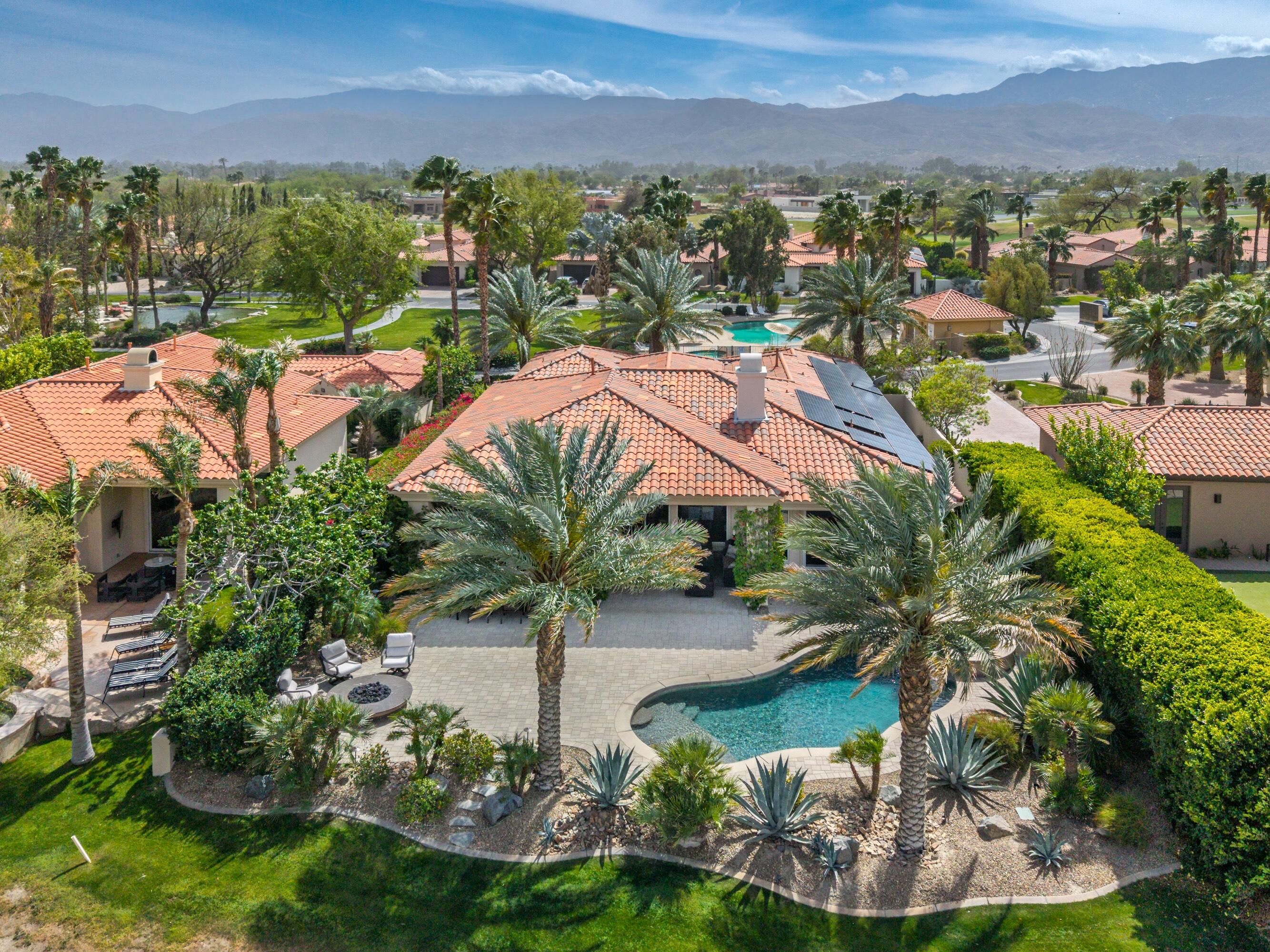 269 Loch Lomond Road Rancho Mirage, CA 92270 - Photo 50 of 53 an aerial view of residential houses with outdoor space and trees
