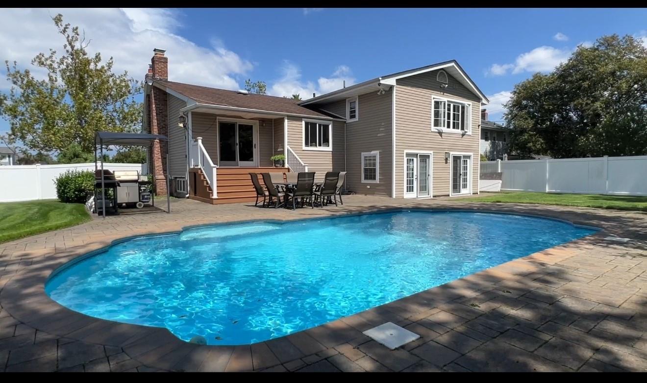 47 Orange Drive Jericho, NY 11753 - Photo 1 of 1 a view of a house with swimming pool