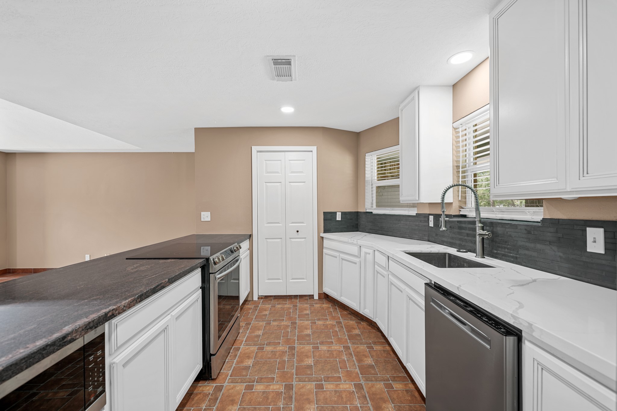 4435 South Tower Road Santa Fe, TX 77517 - Photo 11 of 35 The thoughtfully updated kitchen combines abundant counter space, modern appliances, and generous storage to make meal preparation a pleasure.