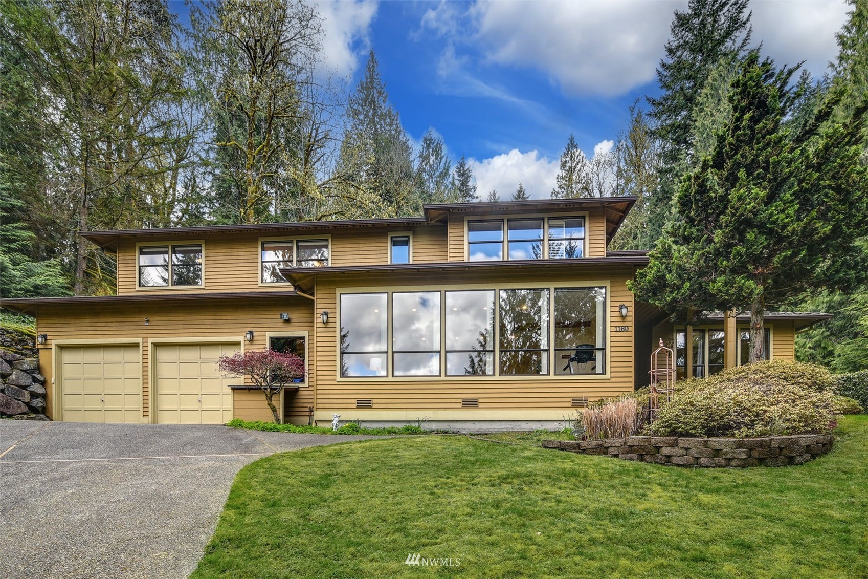 1160 Ridgewood Place Southwest Issaquah, WA 98027 - Photo 2 of 39 a view of a house with backyard and sitting area