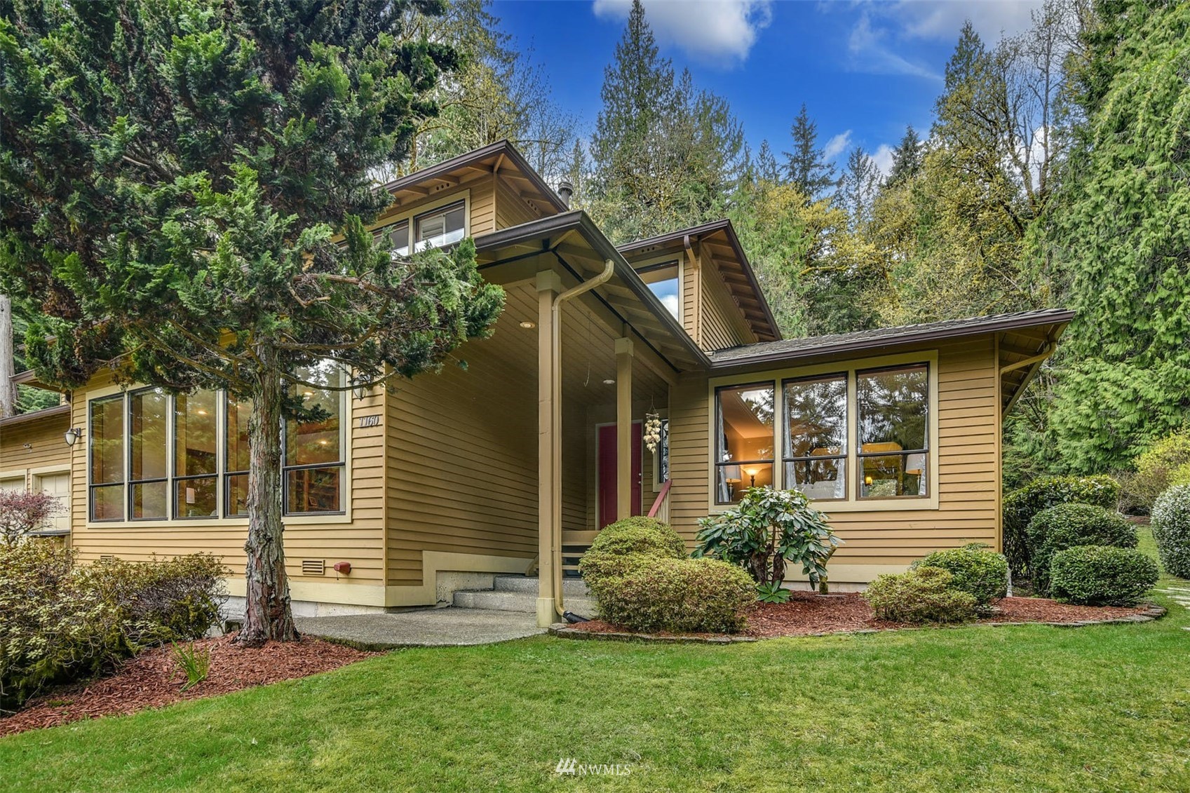 1160 Ridgewood Place Southwest Issaquah, WA 98027 - Photo 3 of 39 a view of a house with a yard and plants