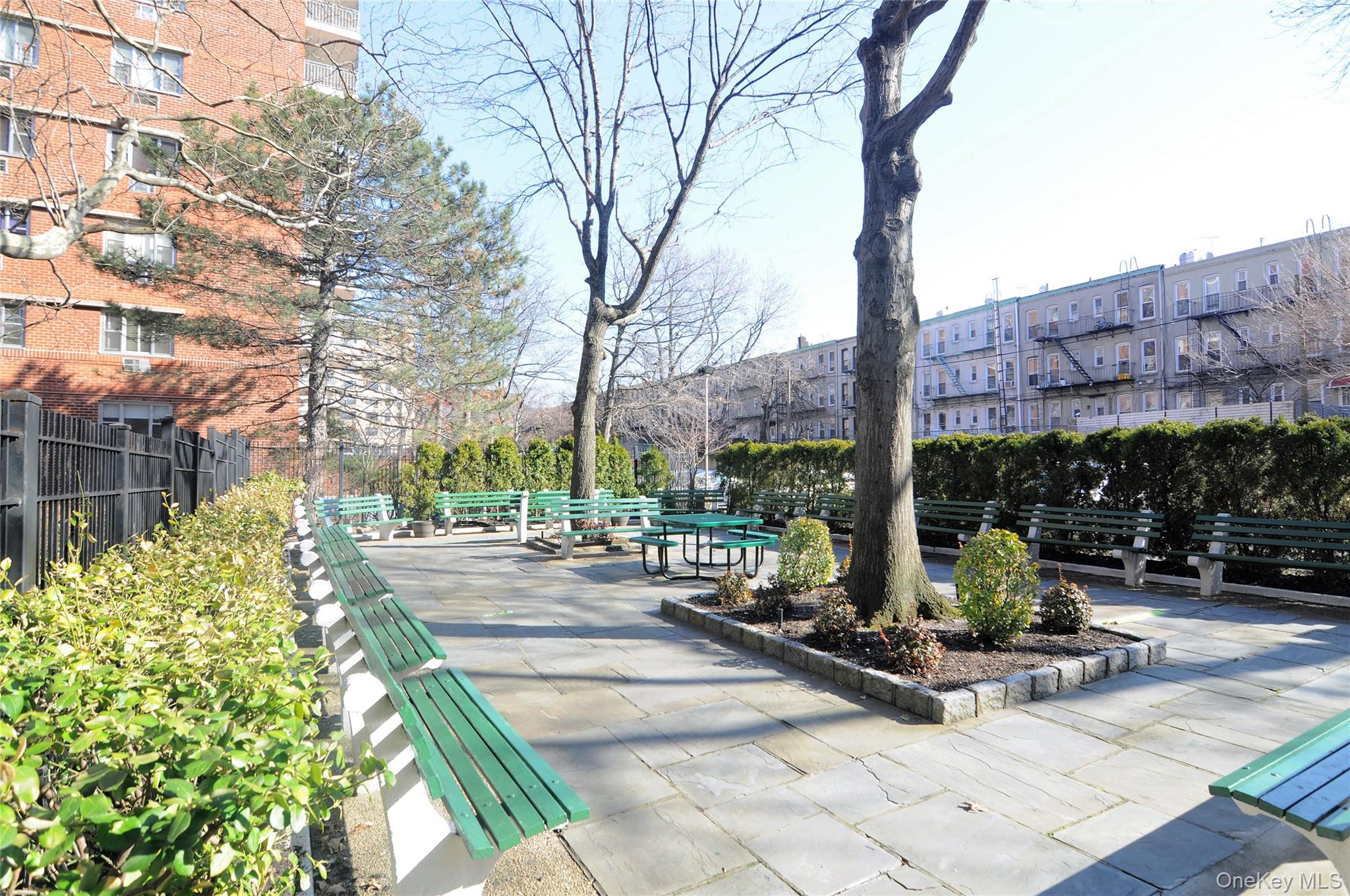 39-65 52nd Street, Unit 2H Queens, NY 11377 - Photo 16 of 18 a view of a street with sitting area