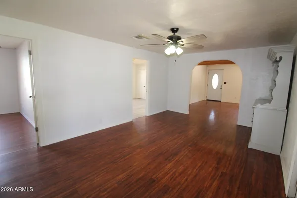 a view of a living room and wooden floor
