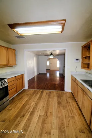 a view of a kitchen with wooden floor