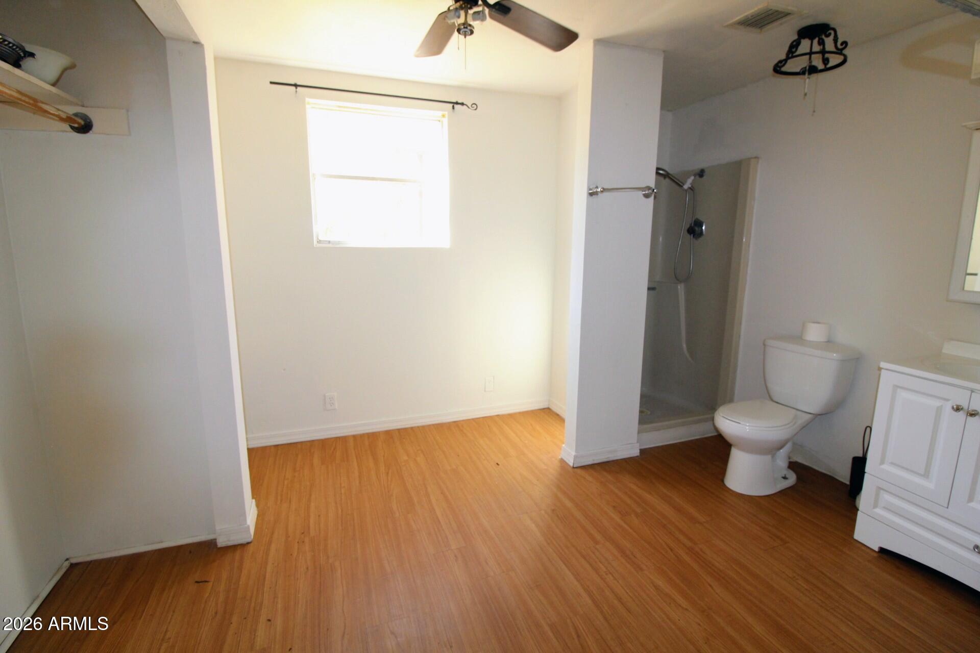 5733 Globe Canyon Road Globe, AZ 85501 - Photo 23 of 30 a bathroom with a toilet and a mirror
