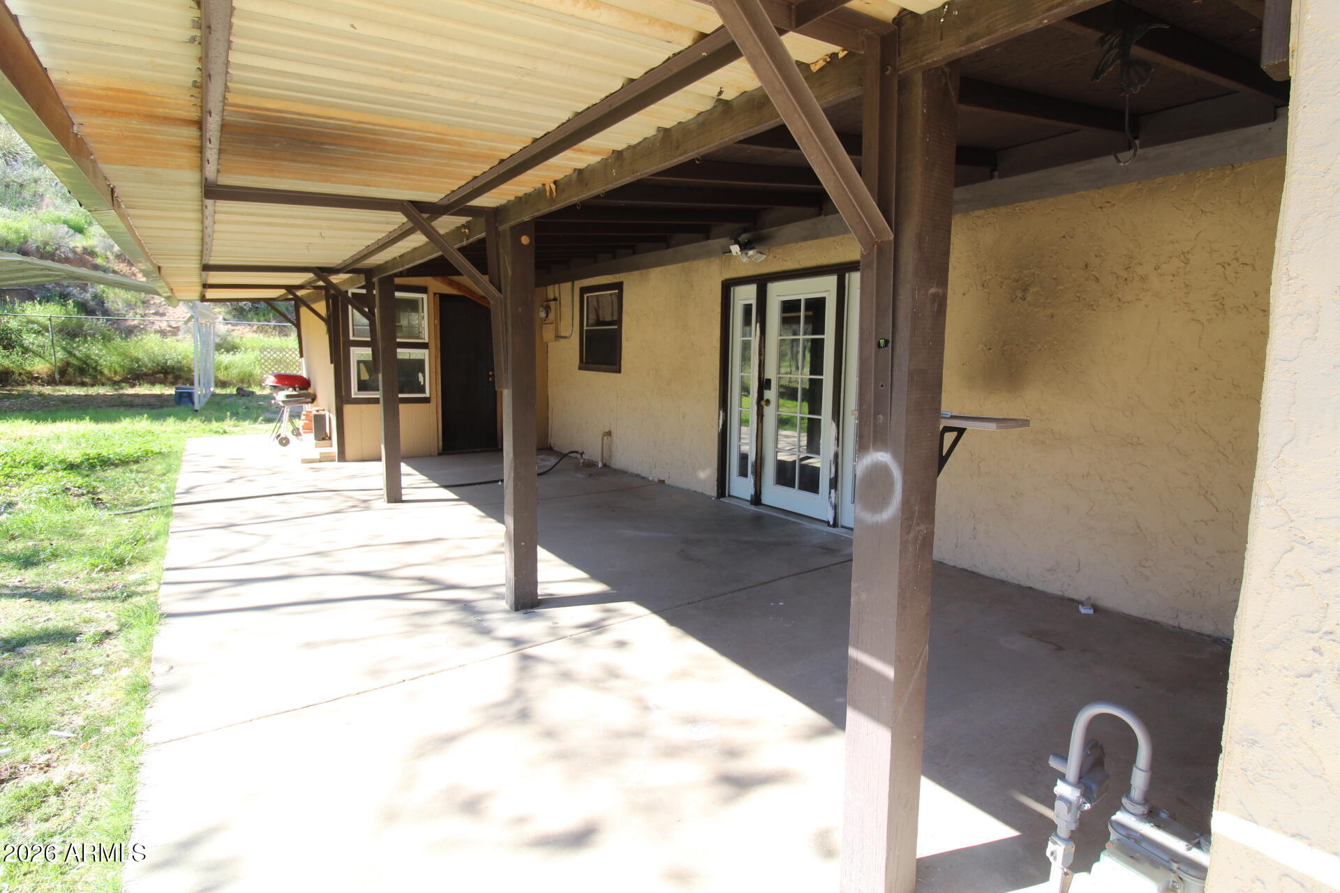 5733 Globe Canyon Road Globe, AZ 85501 - Photo 3 of 30 a view of a porch with a table and chairs