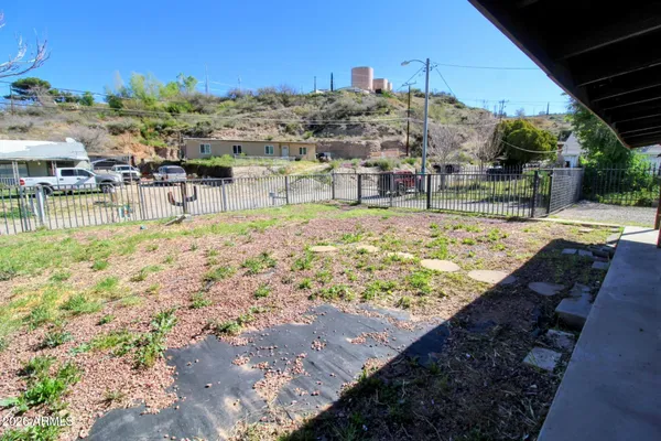 a view of a swimming pool with an outdoor seating