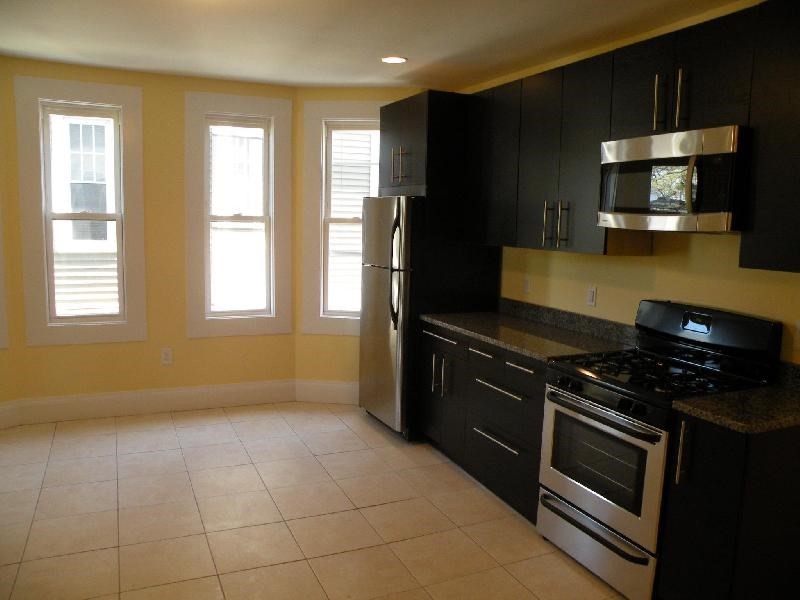 a kitchen with a stove and a microwave