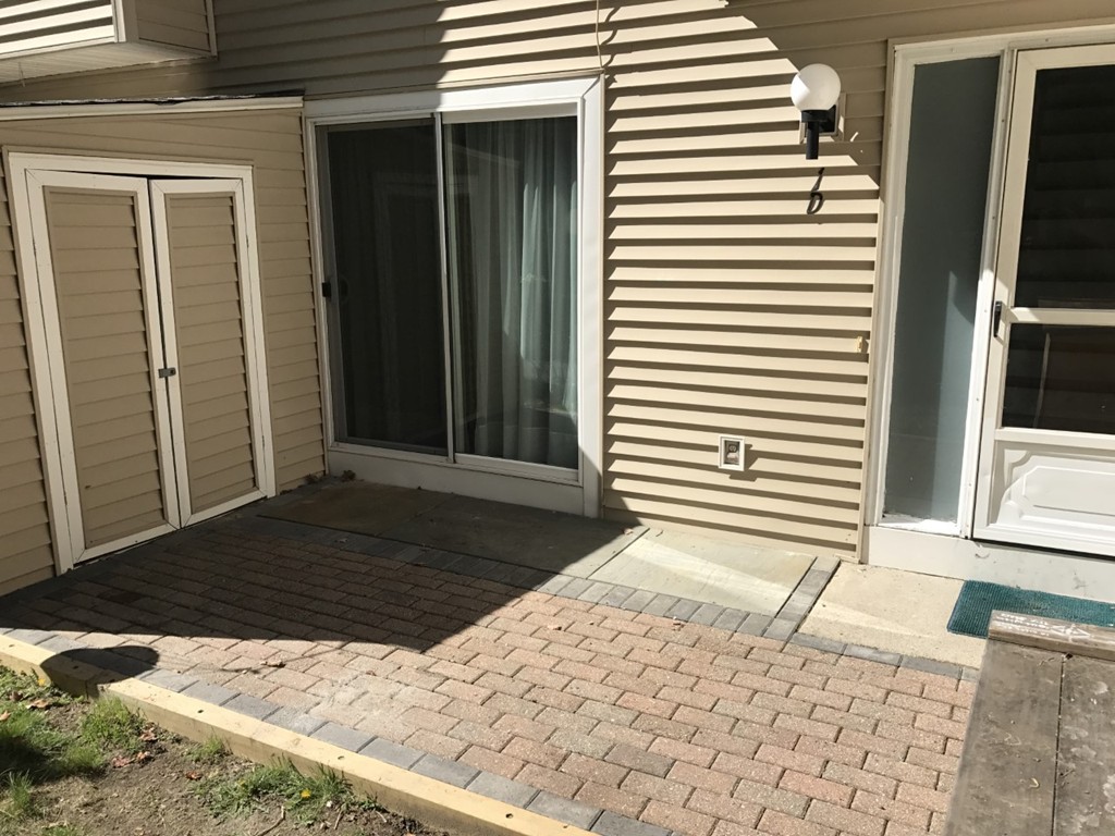 1 Markham Circle, Unit D Ayer, MA 01432 - Photo 11 of 13 a view of a backyard of a house