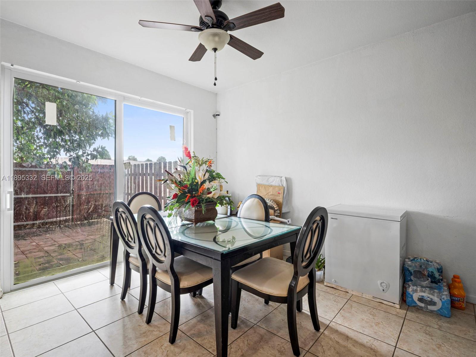 2104 Northeast 3rd Court Homestead, FL 33033 - Photo 14 of 35 a dining room with furniture and window