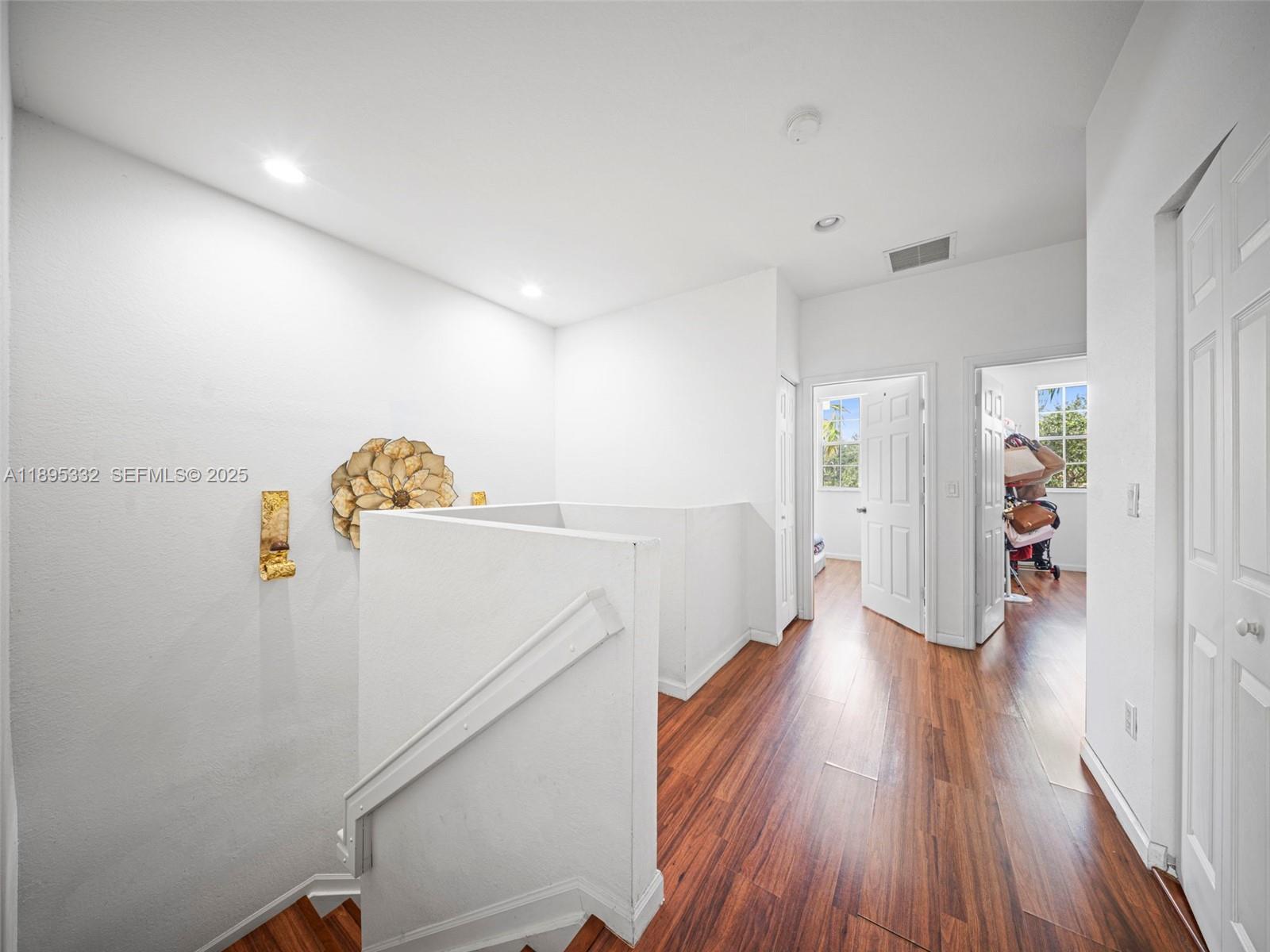 2104 Northeast 3rd Court Homestead, FL 33033 - Photo 18 of 35 a view of entryway with wooden floor
