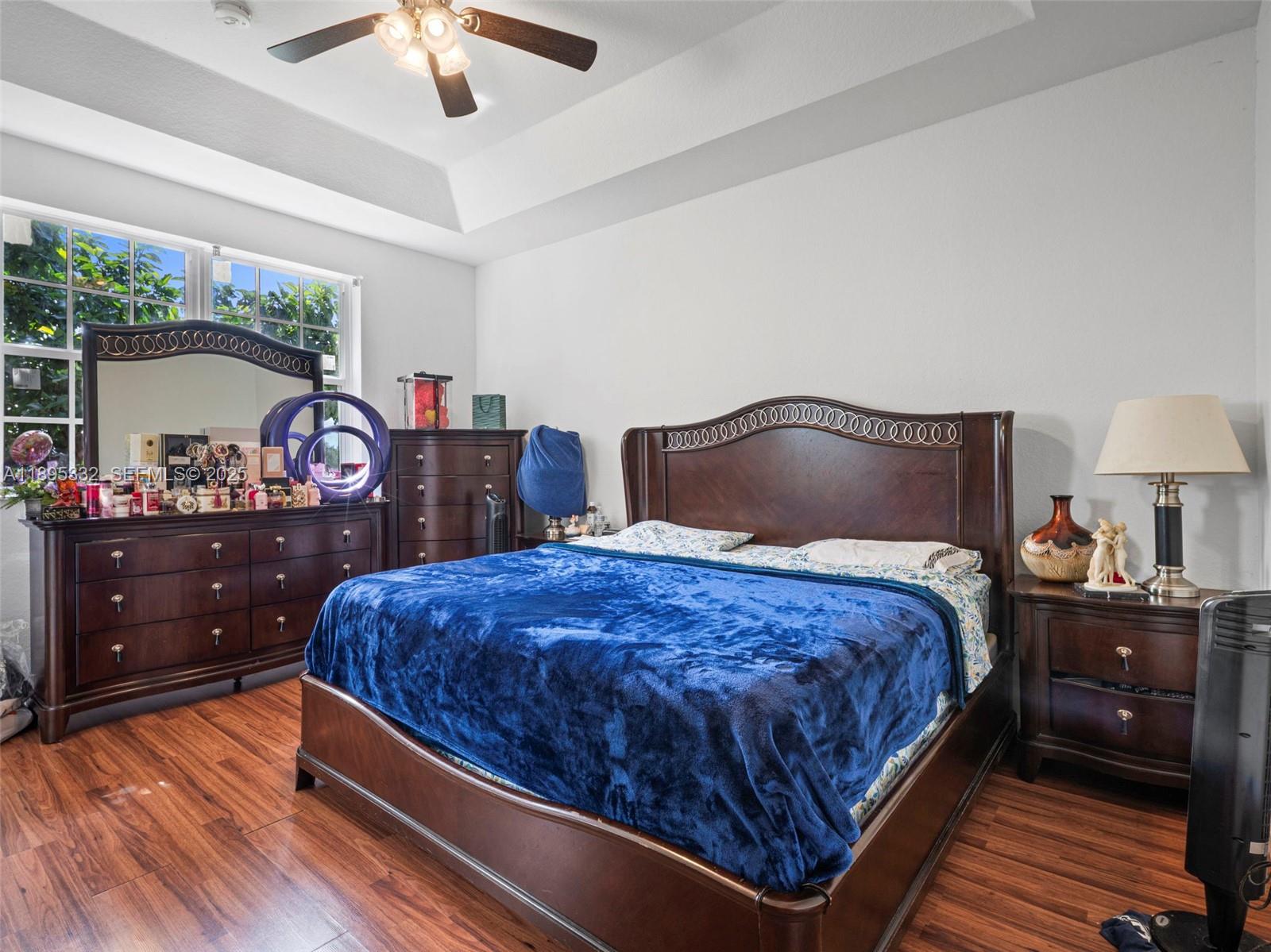 2104 Northeast 3rd Court Homestead, FL 33033 - Photo 19 of 35 a bedroom with bed and window